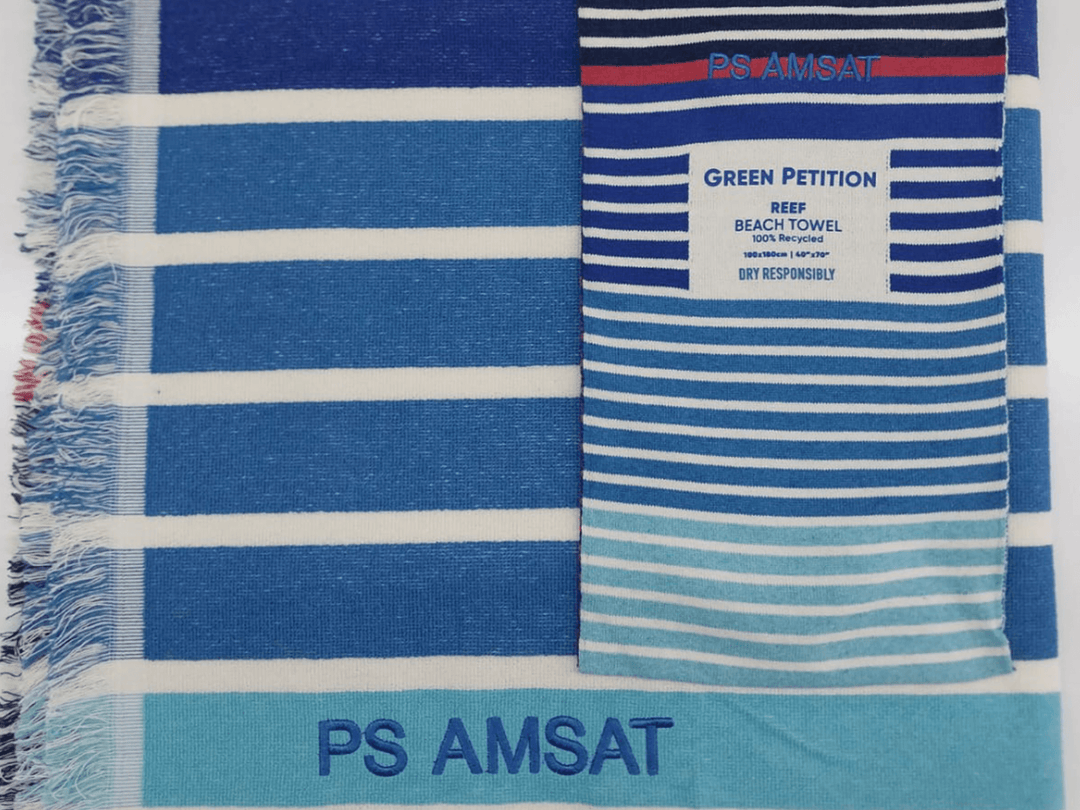 PS AMSAT striped beach towel featuring a vibrant blue and white design, perfect for summer outings.