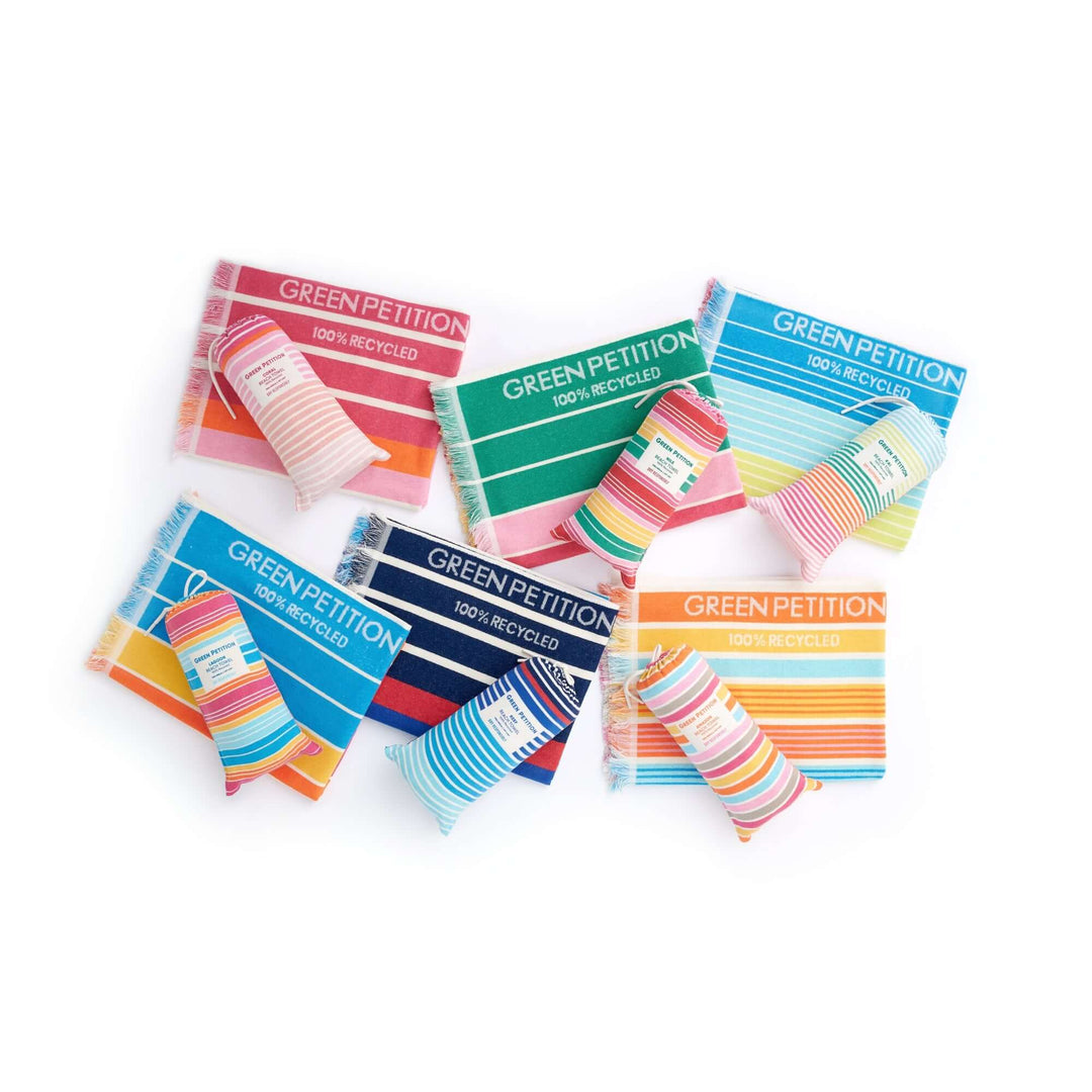 Colorful recycled paper packs labeled 'Green Petition' showcasing eco-friendly products.