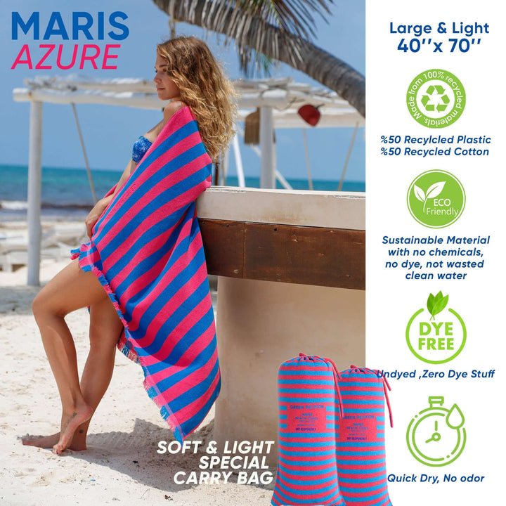 Maris Azure Beach Towel featuring nostalgic stripes, eco-friendly materials, and a special carry bag on a sunny beach.