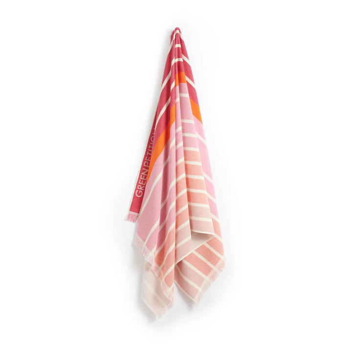 Ocean Coral Candy Beach Towel, eco-friendly, made from recycled cotton and plastic, vibrant striped design, lightweight and portable.