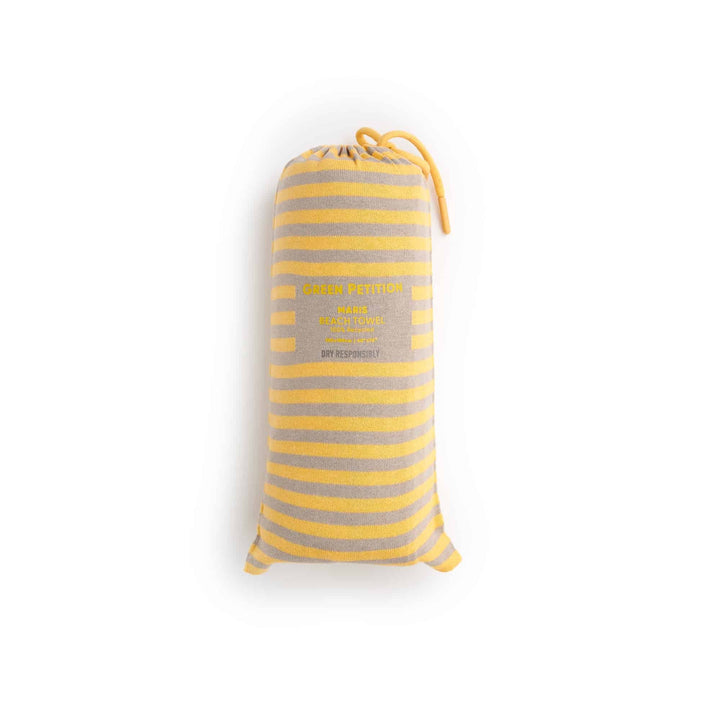 Maris Amber Beach Towel in classic yellow stripes, combining sustainable luxury and timeless design.