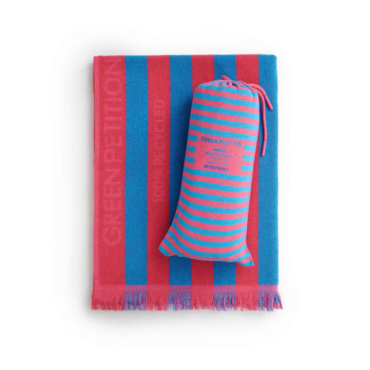 Maris Azure Beach Towel in pink and blue stripes, showcasing sustainable luxury and timeless style.