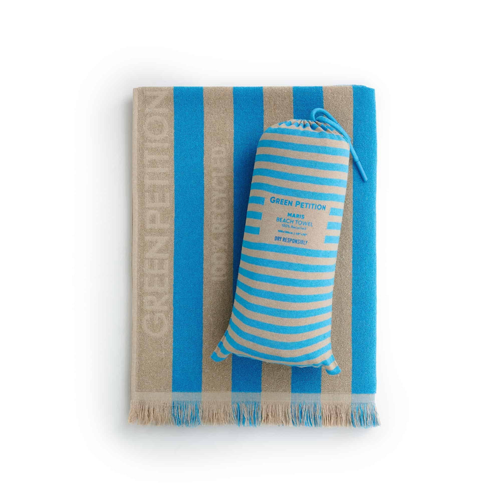 Maris Laguna Beach Towel with blue stripes and sustainable carrying pouch, ideal for eco-conscious beach lovers.