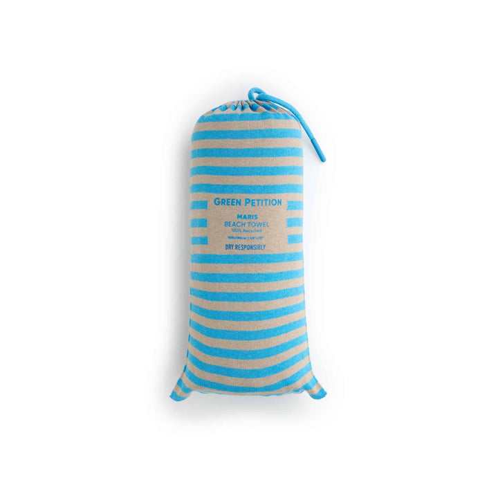 Maris Laguna Beach Towel in blue and beige stripes, featuring sustainable luxury and classic charm.