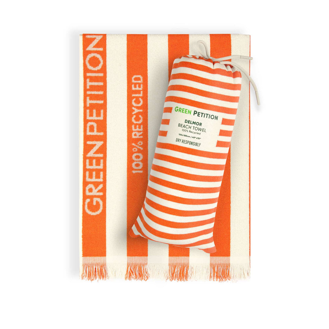 Orange and white striped DELMOR Tangerine beach towel with &