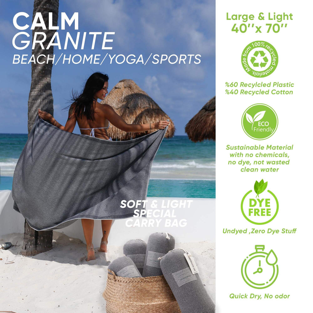 Woman drapes Calm Granite towel on the beach; eco-friendly, soft, large 40"x70" for home, yoga, and sports.